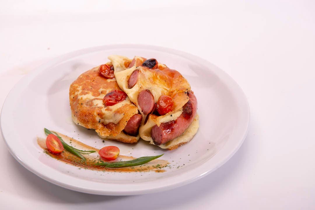 salchichas parrillera (250gr) gratinada con provoleta